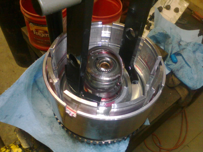 Now we can bring the assembly over to the spring compressor and weasel a snap-ring in there to hold the input hub on